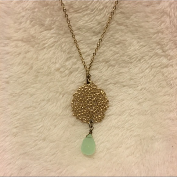 Gold necklace with pale green stone
