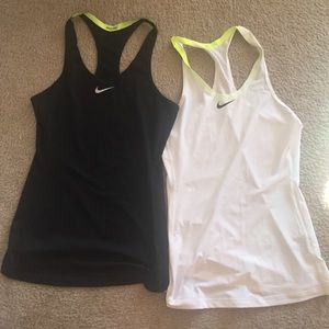 Two Nike pro tanks