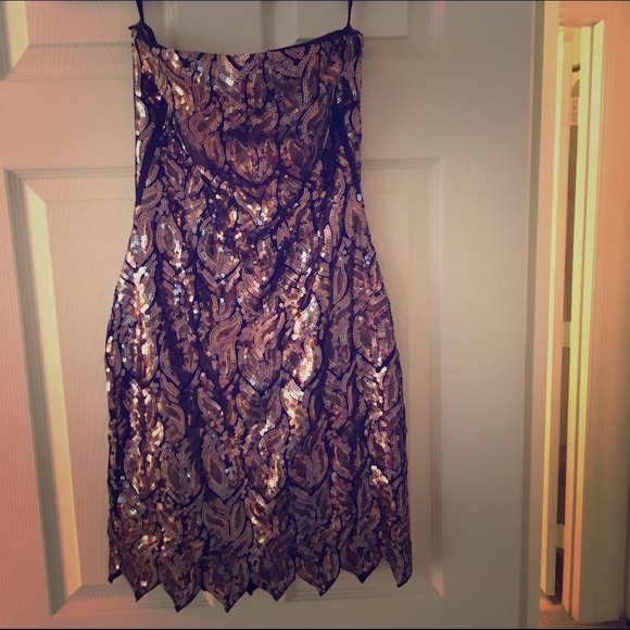 Bebe sequined dress with tags still attached.