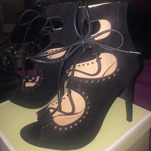 Black strap up heels