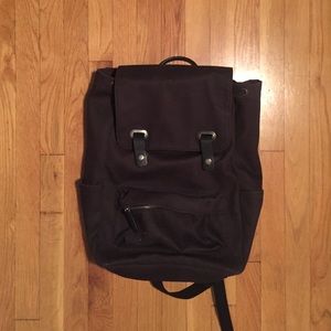 Everlasting canvas backpack with leather detail.