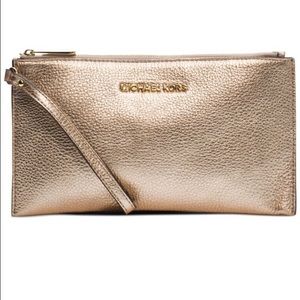 Michael Kors wristlet; pale gold. Tags still on!
