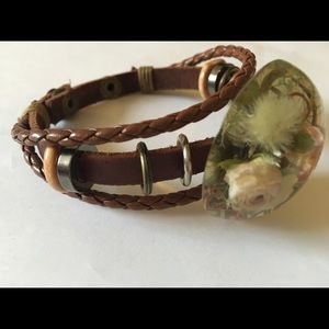 Leather bracelet with real dry flowers.