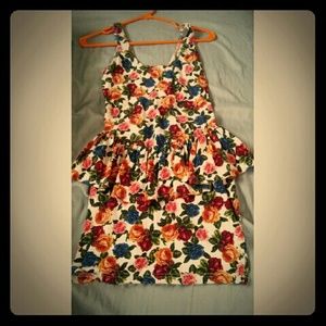 A cute sleeveless floral peplum dress!