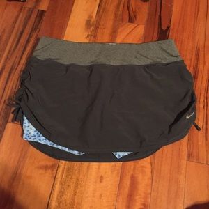 Nike DRI-FIT shorts with gray skirt on top
