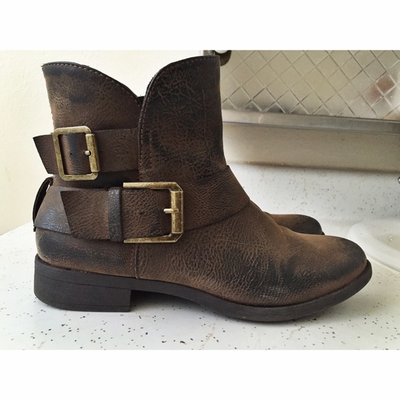 Brown booties with gold buckles