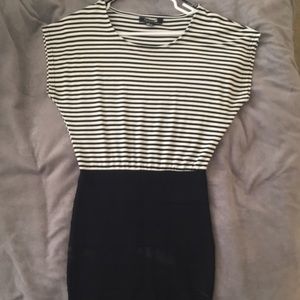 Black and white dress, with tight skirt.