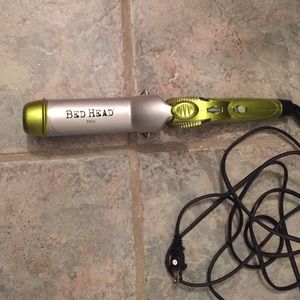 Bed head curler with clamp