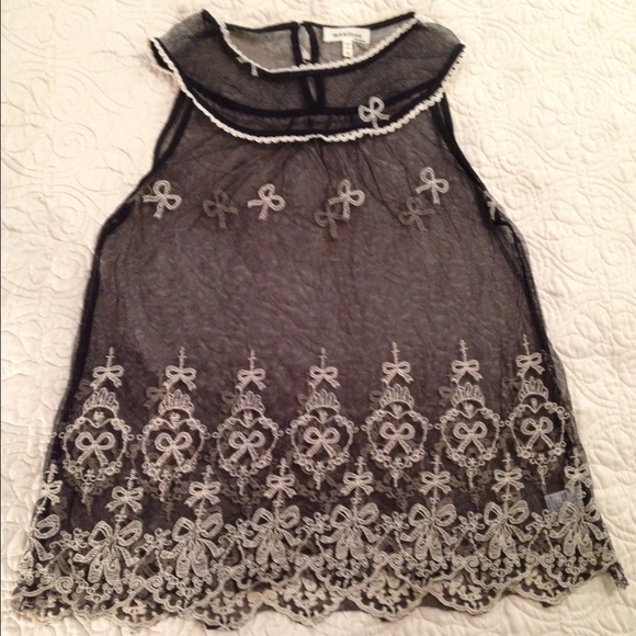 Sheer, sleeveless, babydoll cut blouse