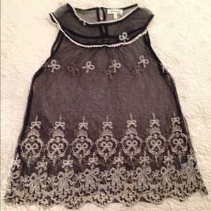 Sheer, sleeveless, babydoll cut blouse