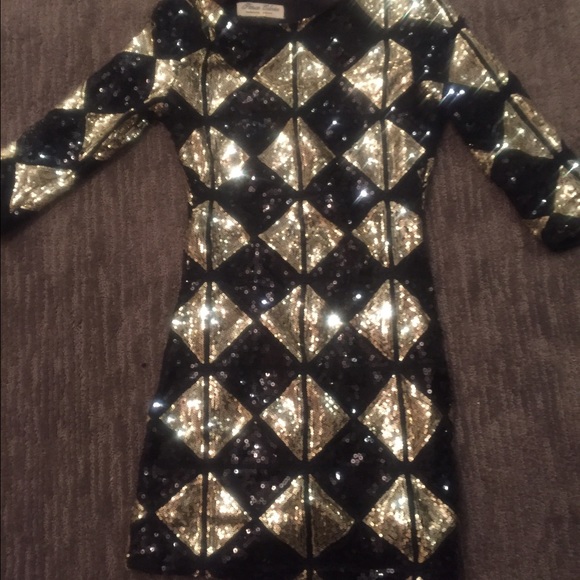 Black and gold sequin cocktail dress.
