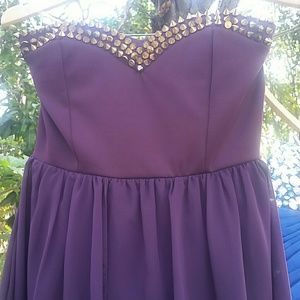 Spiked purple dress.