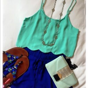 Mint green sleeveless top.