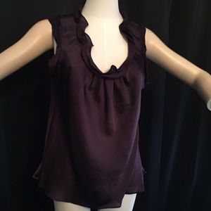 Dark purple top with ruffle around scoop neck