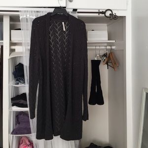 Gray knit long sweater.