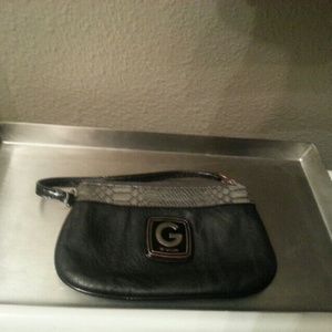 Black wristlet by GUESS