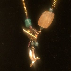 Gold necklace w/ turquoise bird in flight charm