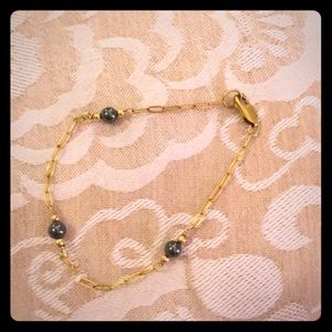 Gold and onyx bracelet