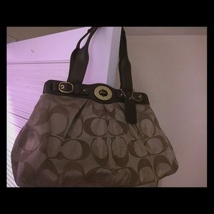 Coach bag with lock buckle