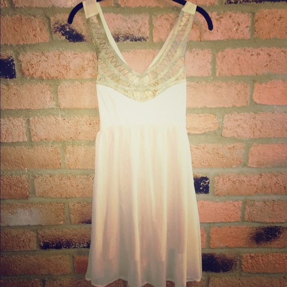 Elegant cream beaded Gold and sheer backless dress