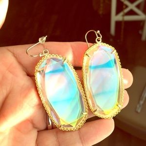 Iridescent clear Deily with gold hardware.