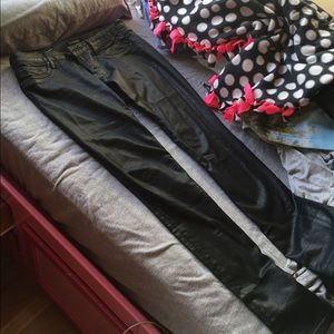 Coated black skinny jeans