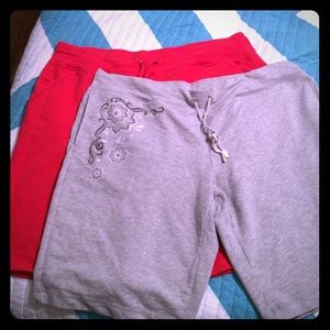 Two pairs of Bermuda length sweat shorts