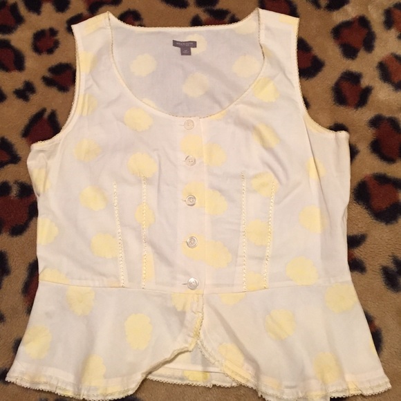 Yellow floral pattern top.