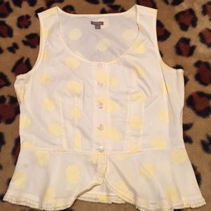 Yellow floral pattern top.