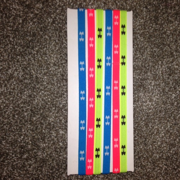Blue, pink, and green under armor headbands
