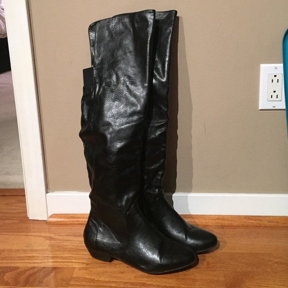 Over the knee flat boots