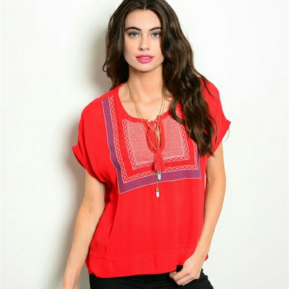 Red peasnt top with white and blue embroidery