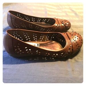 Brown punched leather flats