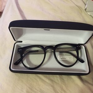 Black framed glasses never worn. Original sticker.