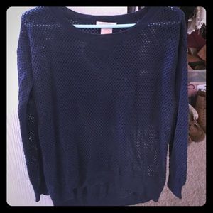 Navy sweater with holes - the good kind.