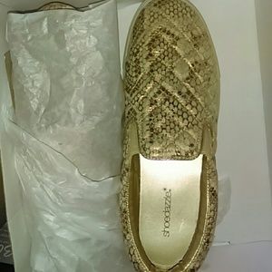 Gold/White Slip on Shoes.