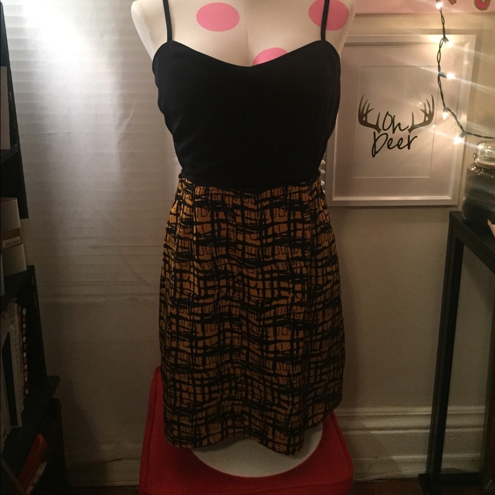 Black and gold dress with side cut outs