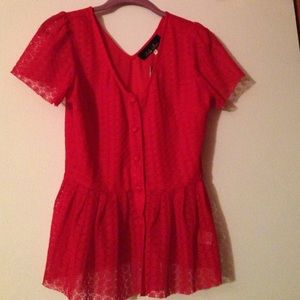 Cute peplum button down top in a pure red color