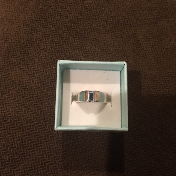 Silver and blue topaz ring