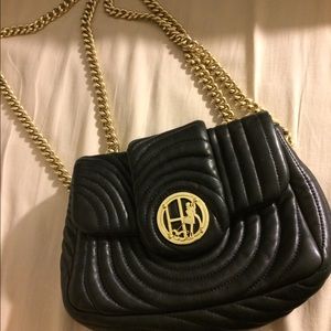 Henri Bendel black and gold cross body purse.
