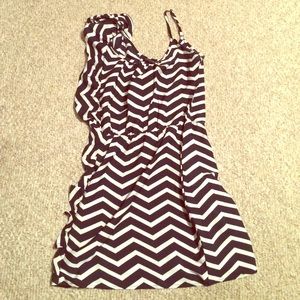 A cheveron dress with one ruffle sleeve