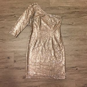 One shoulder sequin dress.
