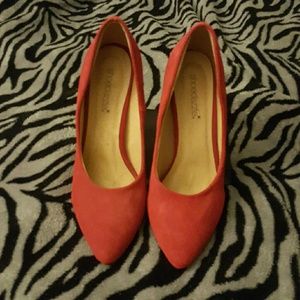 Suede red pumps
