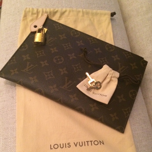 Louis Vuitton Handbags - Louis Vuitton monogram pouch with lock and key.
