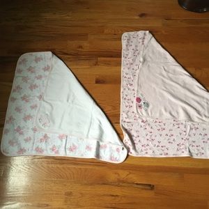 Two baby girls receiving blankets