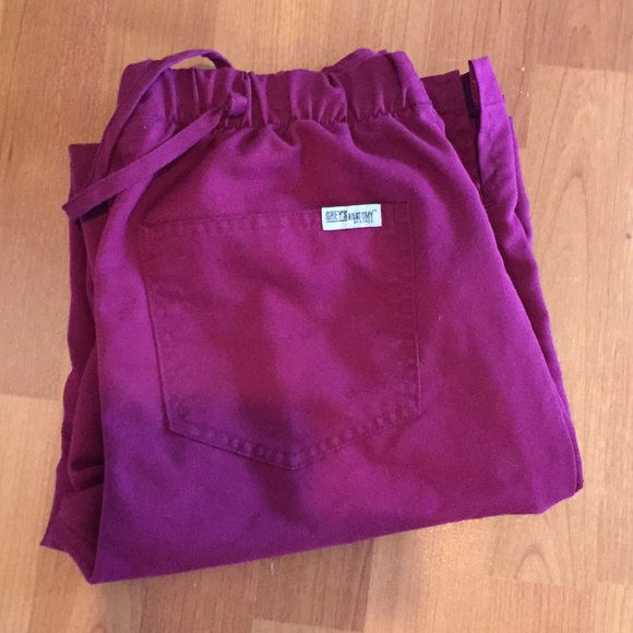 Grey anatomy wine colored scrubs.
