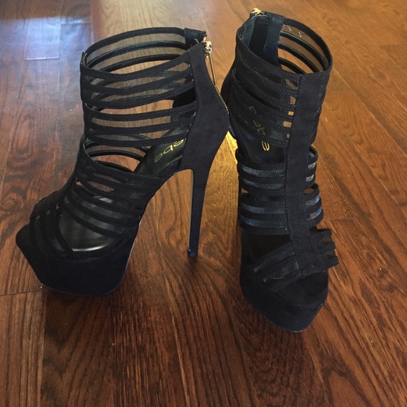 Never worn Bebe black Suede platform pumps. Size 6