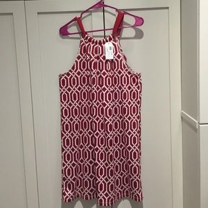 Size M. Ties into bow on back of neck.