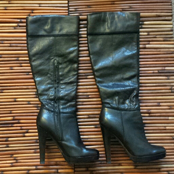 Below the knee black leather boots