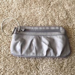 A silver wristlet.